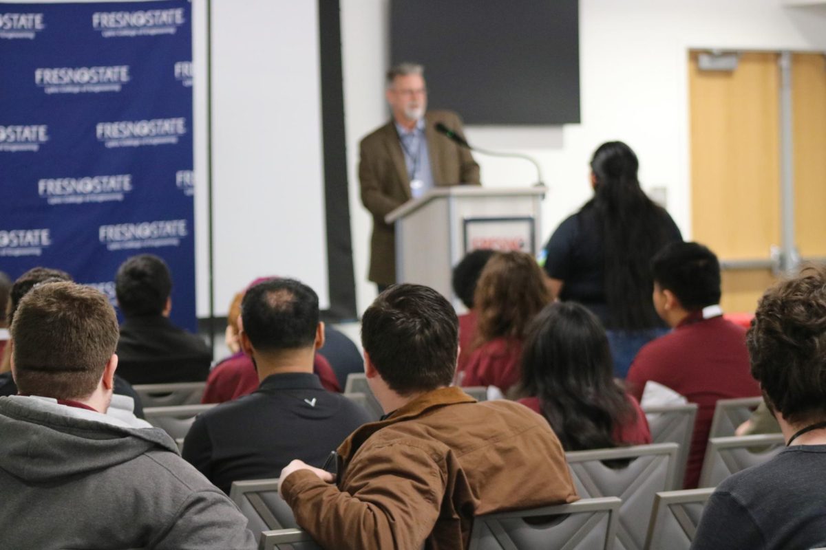 People sit in the audience at the 65th Annual Geomatics Engineering Conference on Jan. 23.