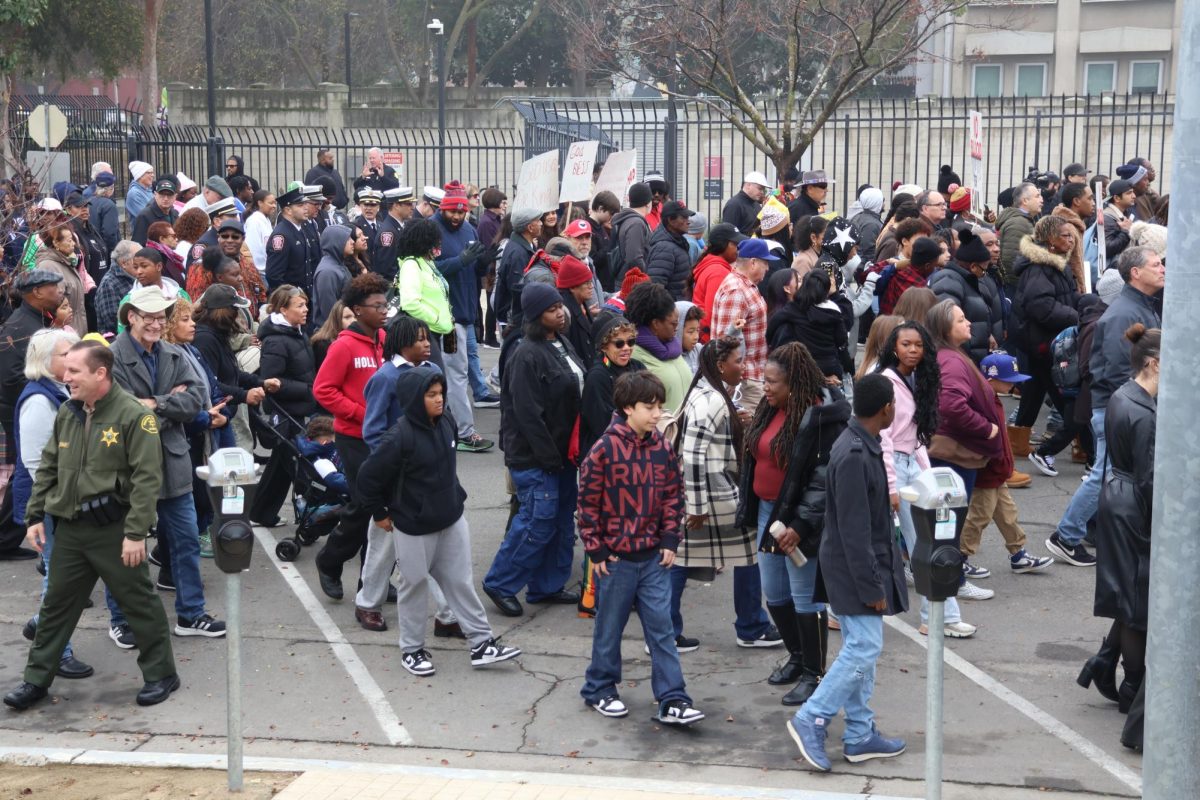 Fresno citizens gather together and march for MLK Day in front of St. John's Cathedral in Fresno on Jan. 19.