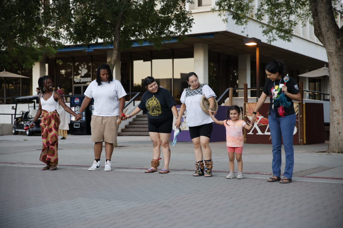 Members of the campus community participate in an outside dance class at the Rhythms of Heritage event on Oct. 3, 2024.
