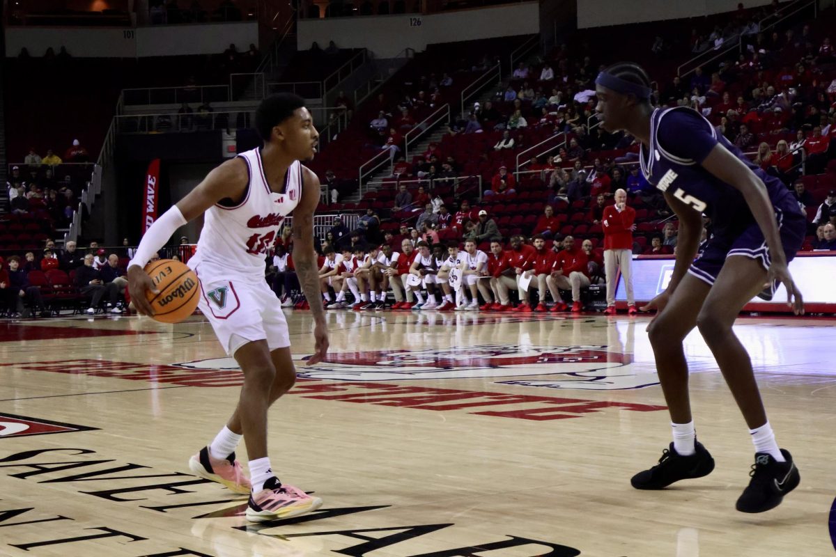 Fresno State men's basketball guard Zaon Collins sizes up a Utah State Aggie defender on the right wing on Dec. 30, 2025, at the Save Mart Center.