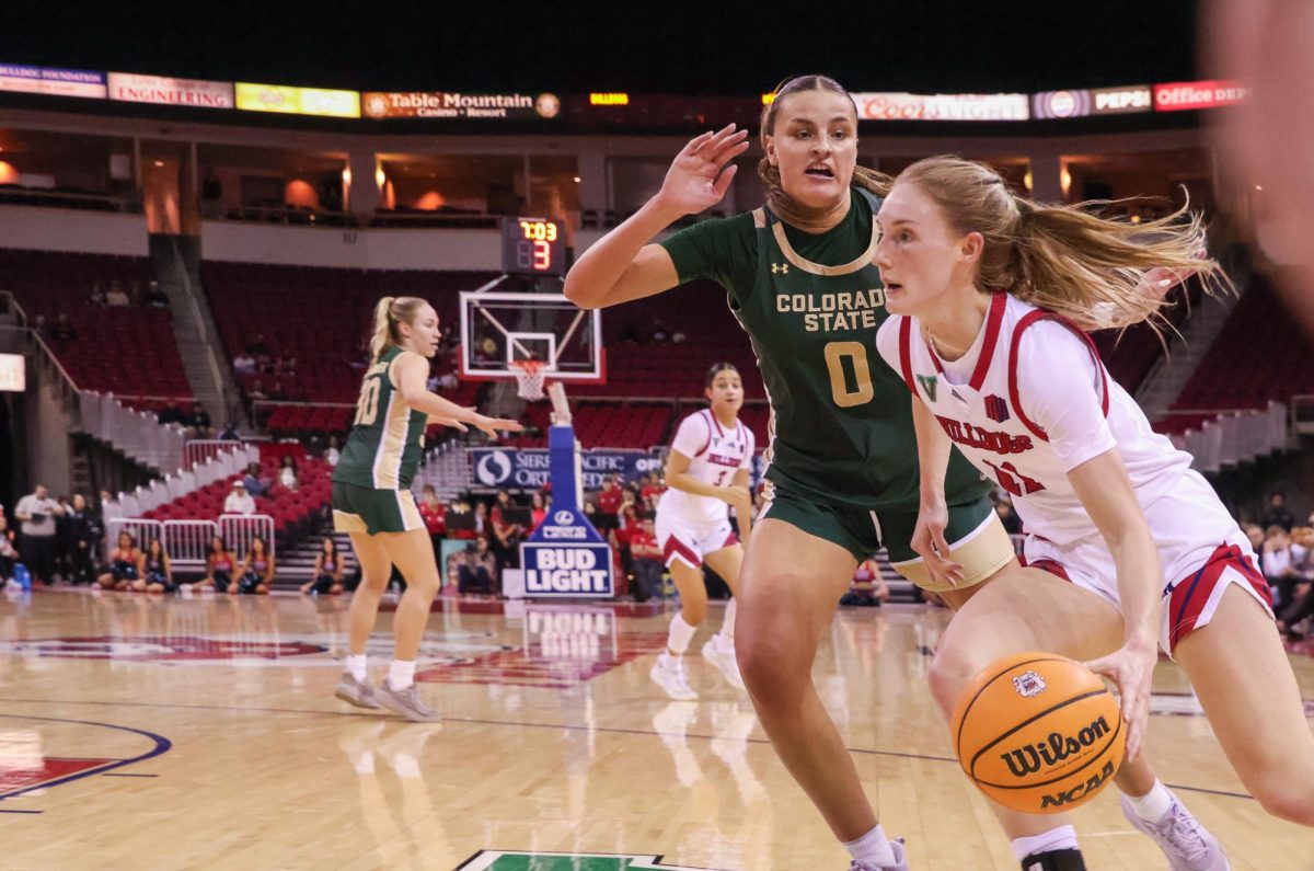 Fresno State women's basketball guard Emilia Long drives on Colorado State Rams' forward Madelyn Bragg down the baseline on Jan. 24 at the Save Mart Center.
