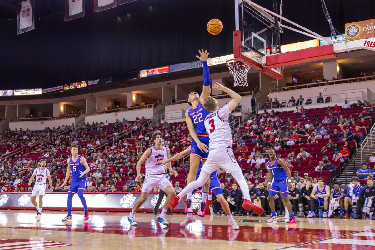 Fresno State men's basketball guard Jake Heidbreder (3) floats a shot against Boise State Broncos forward Javan Buchanan (22) on Feb. 28 at the Save Mart Center. 