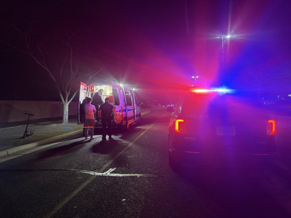 An ambulance and a police car at the scene of a scooter collision that took place on Bulldog Lane and Woodrow Avenue on Feb. 10 at approximately 6:15 p.m.