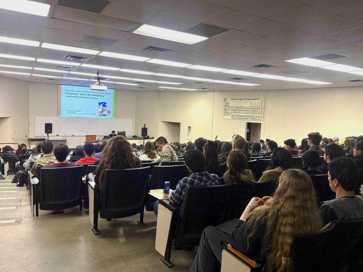 Hirokazu Yasuhara presents in McLane Hall to a full classroom on Feb. 20.