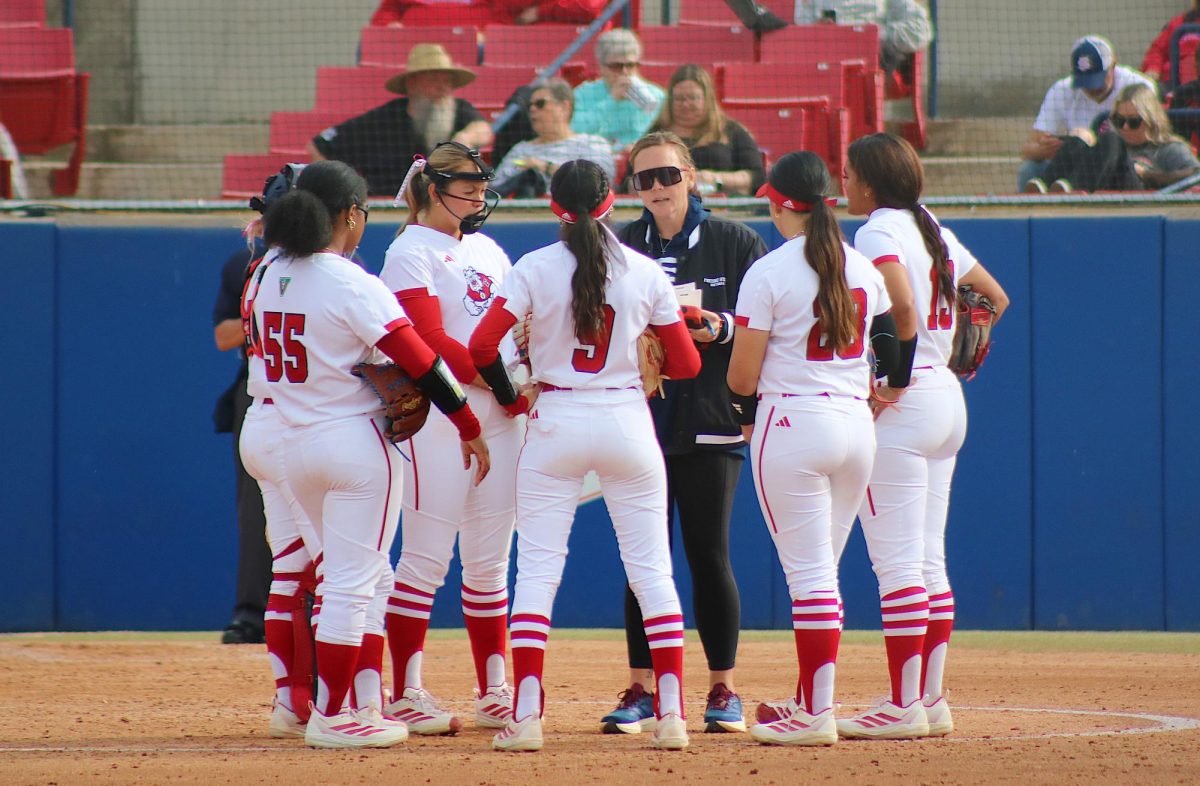 Fresno State softball Head Coach Charlotte Morgan meets in the circle with the infielders on Feb. 14 at Margie Wright Diamond.