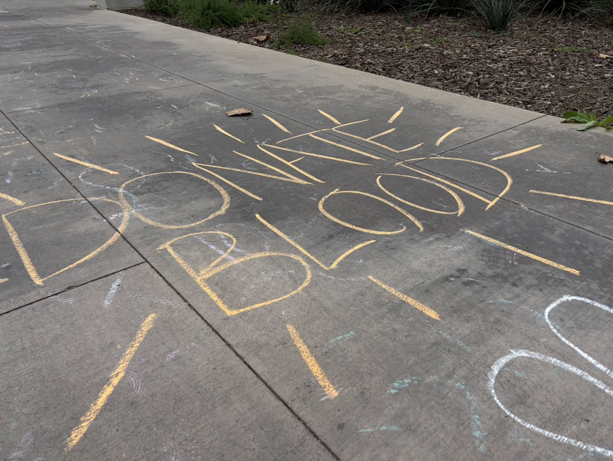Chalk drawn onto the cement near the Resnick Student Union that says, "Donate blood," on Feb. 9.