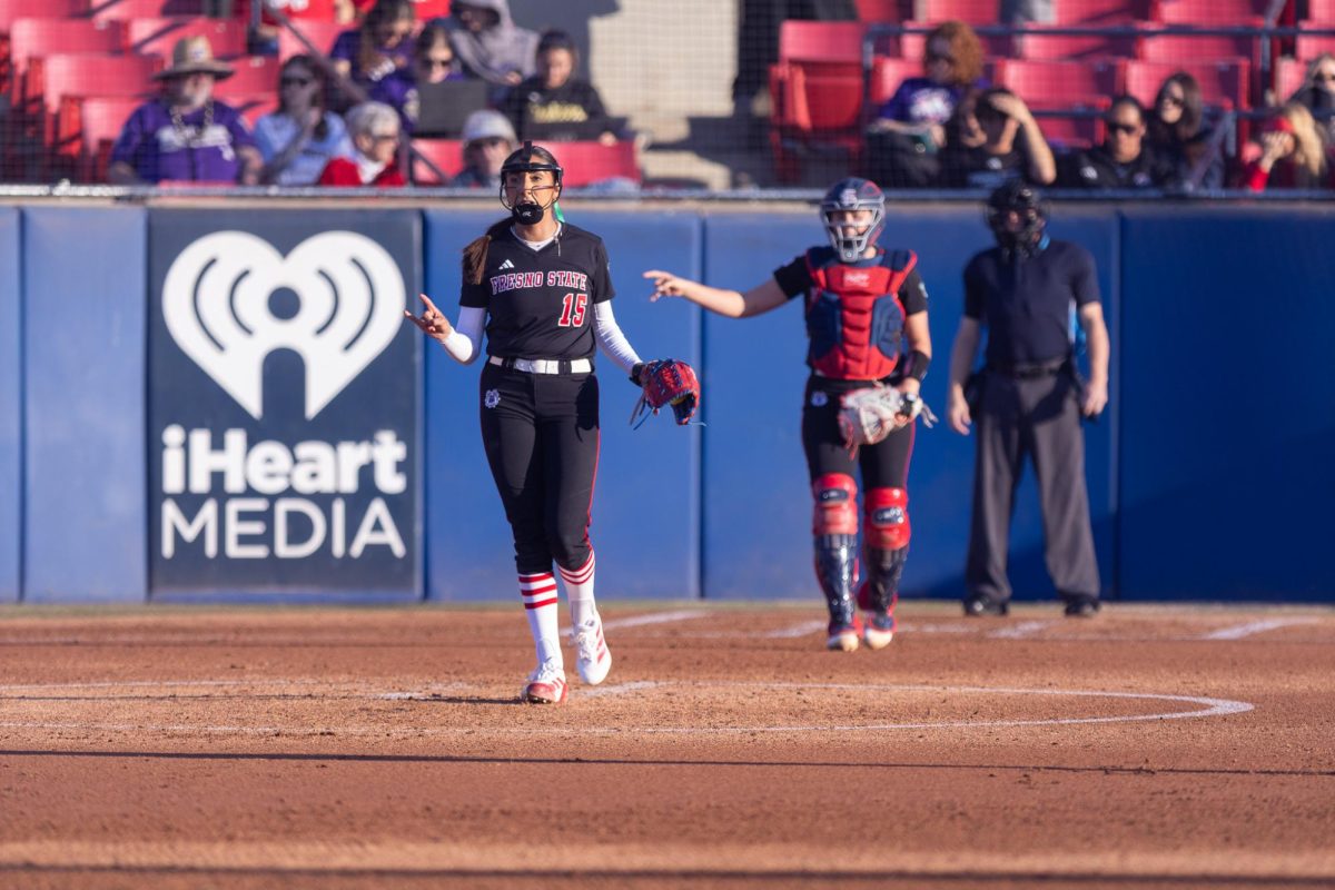 Fresno State softball pitcher Lauryn Carranco signals to the defense that there are two outs on Feb. 13 against the Washington Huskies at Margie Wright Diamond