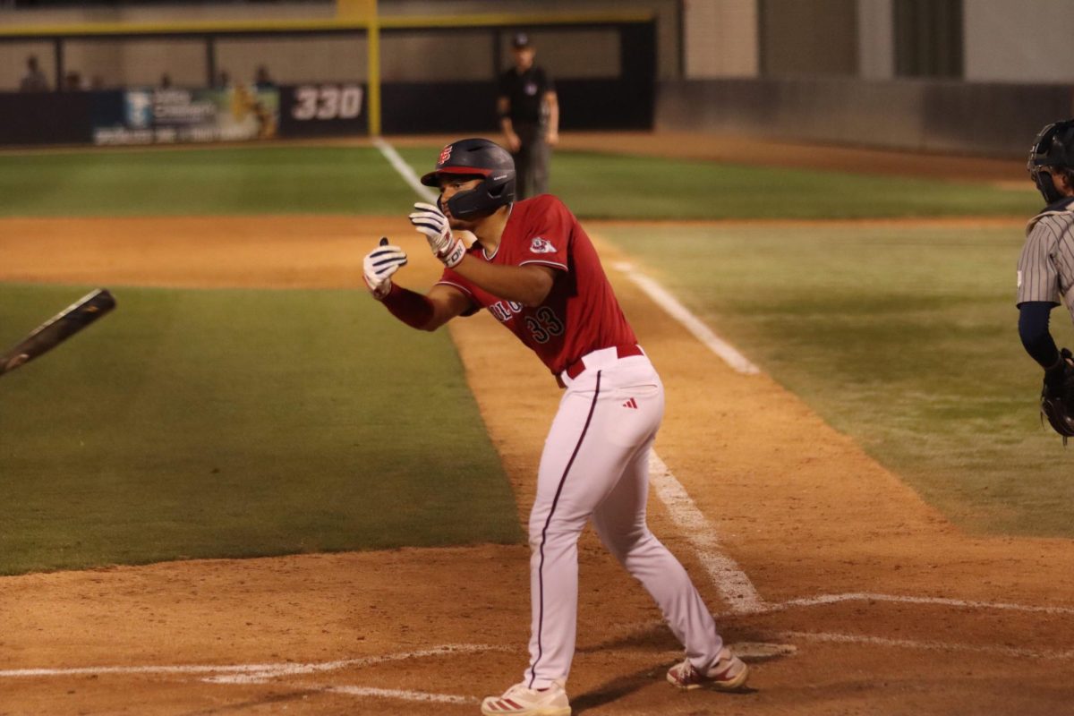 Marcus Nolen tosses his bat to the dugout after forcing a walk in the bottom of the fifth inning.