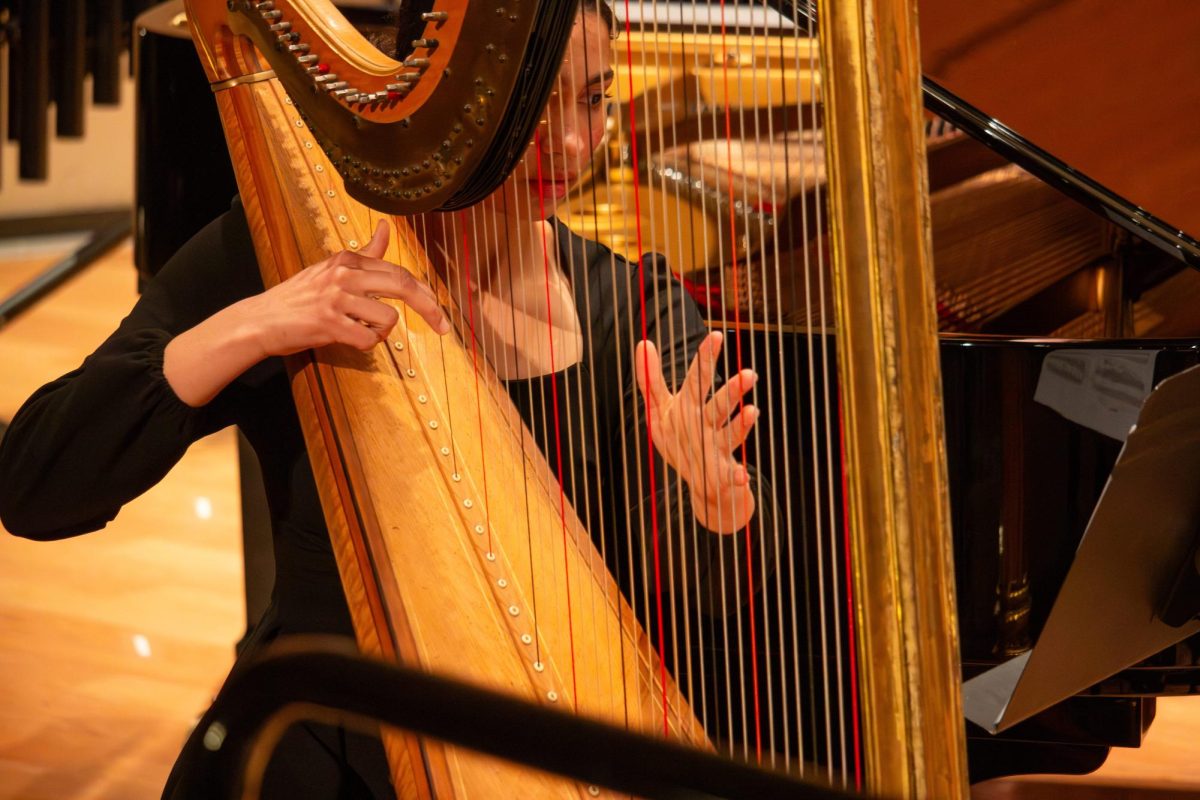 Lydia Thompson plays the harp.