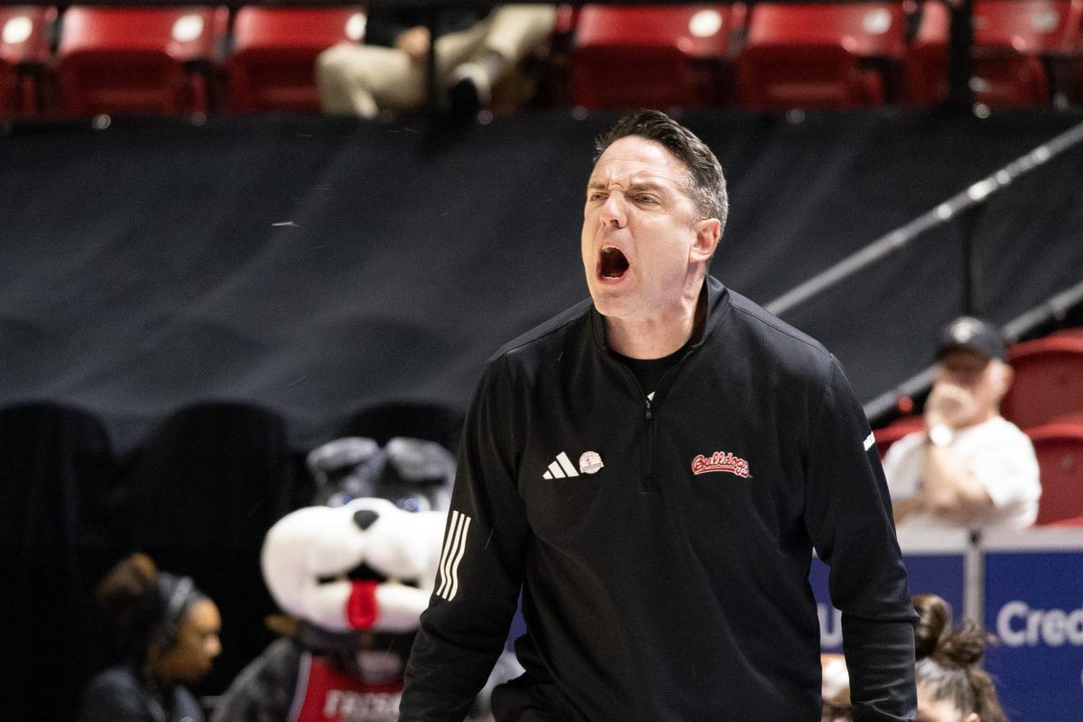 Ryan McCarthy yells over to his team during the first quarter of his team's quarterfinal match against the University of Nevada, Las Vegas, on March 8 at the Mountain West Tournament. McCarthy and the 'Dogs will join the Pac-12 next season with three other teams from the Mountain West.