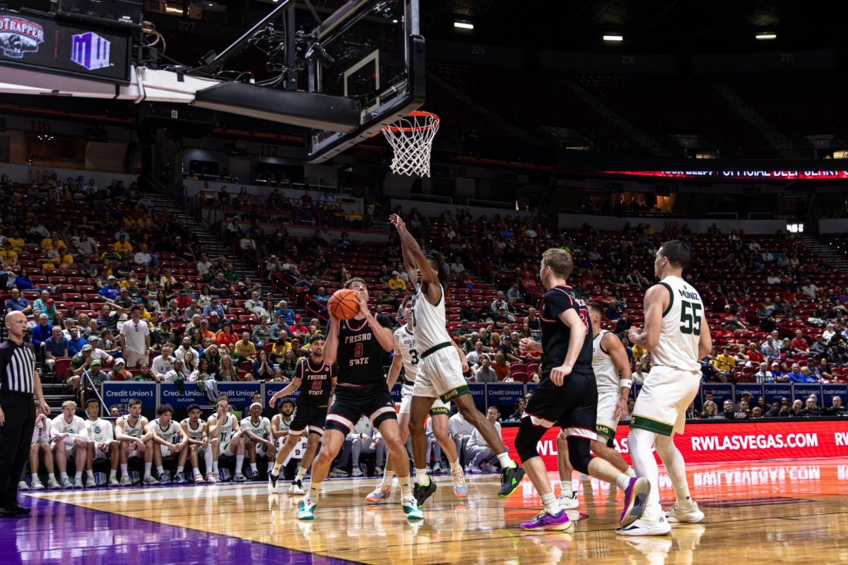 Gasper Kocevar goes up for the put back layup through contact against a Rams defender. Kocevar led the team with 14 points in the first half.