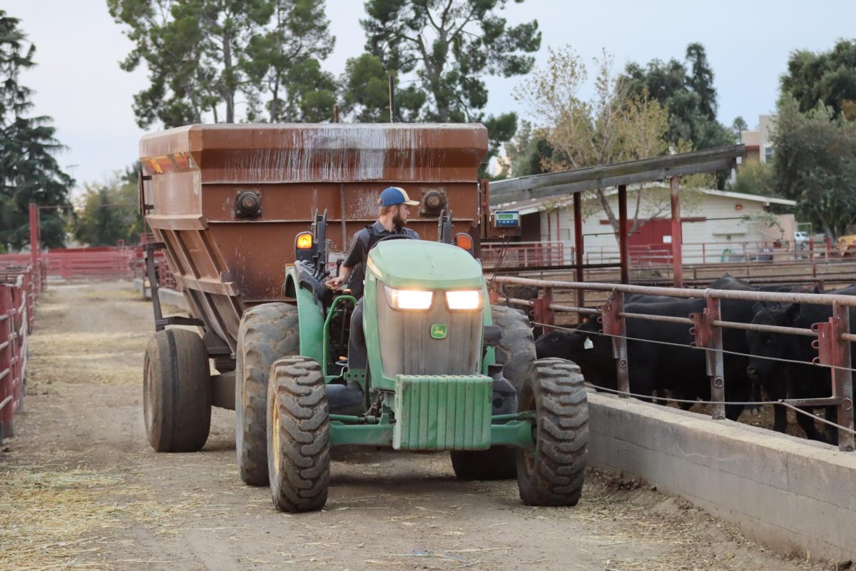 A man drives a tractor at Fresno State in Fall 2025.