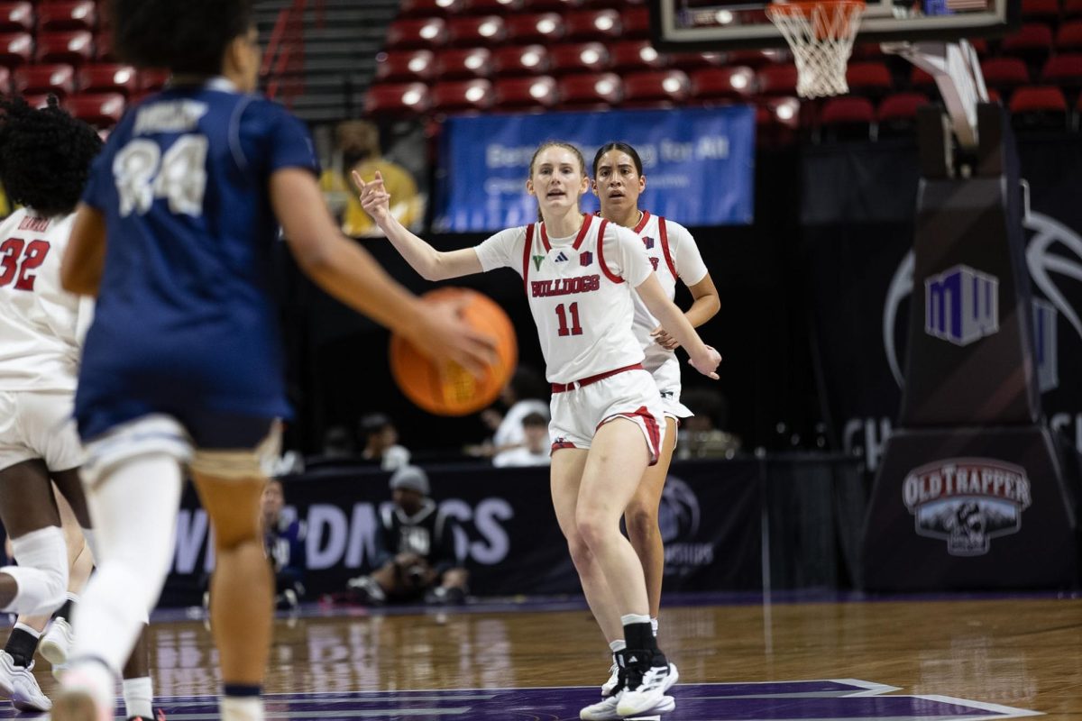 Fresno State women's basketball guard Emilia Long points as she anticipates the oncoming Nevada Wolf Pack attack on March 7 at the Mountain West Tournament in Las Vegas. Long led the 'Dogs with 15 points in the first-round win. 