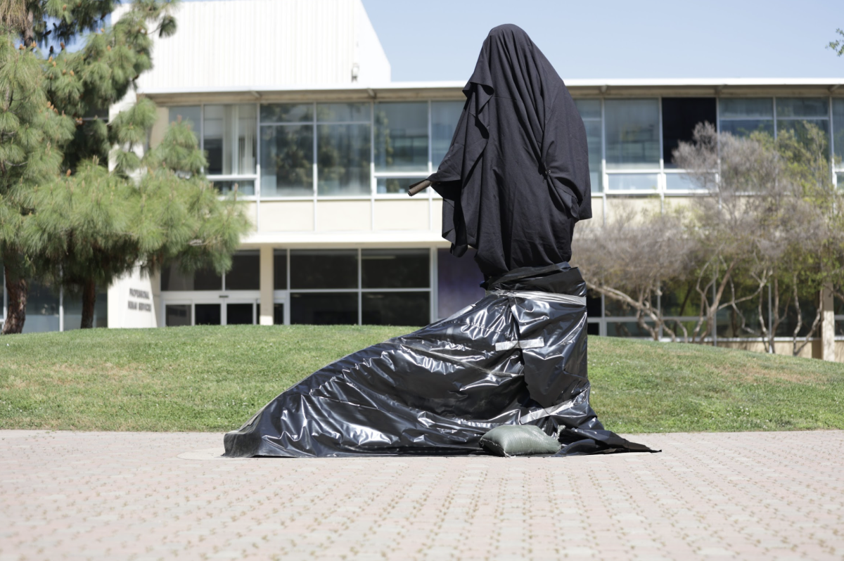 The covered statue of César Chávez in the Peace Garden on March 18.