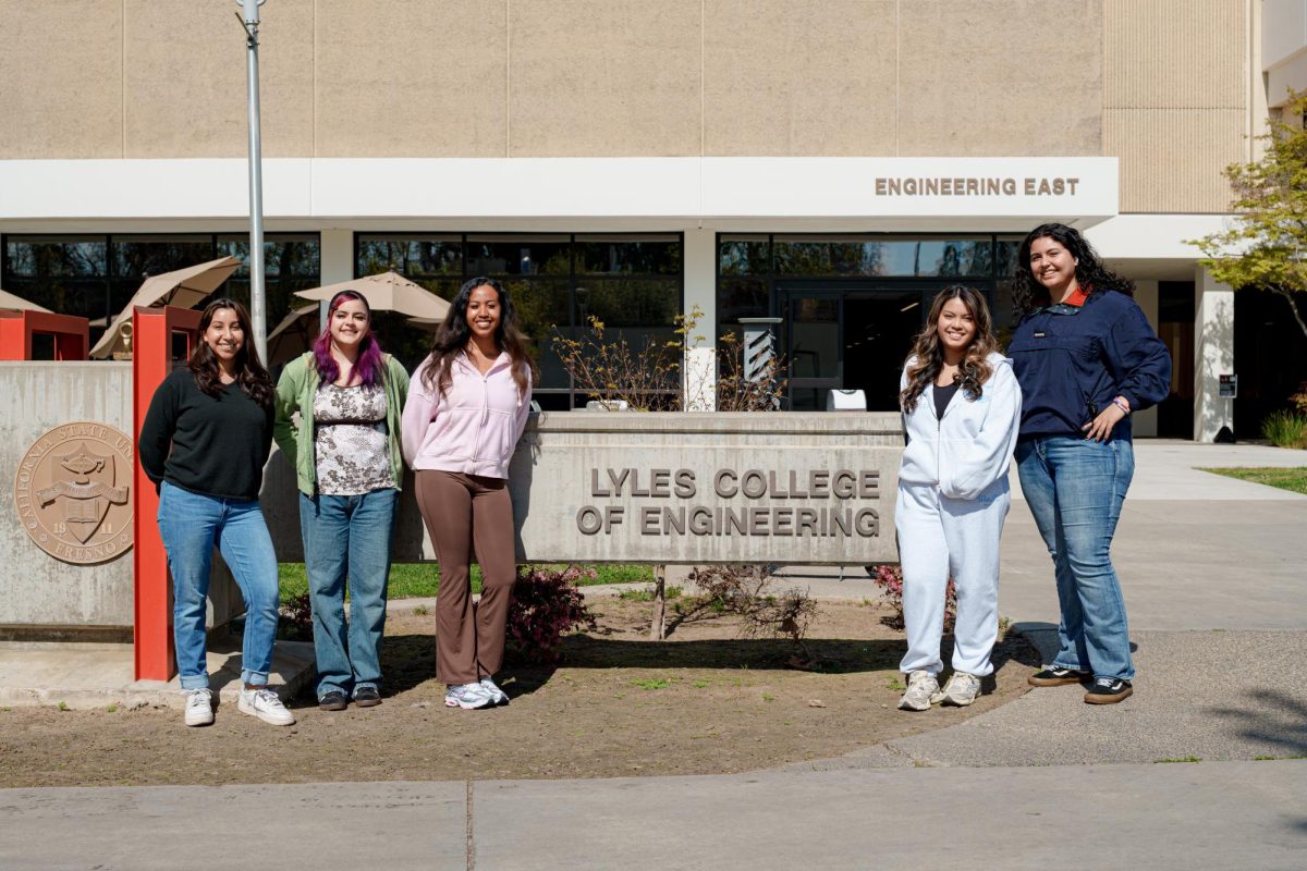 (From left to right) Sydney Rivera, Natasha Iqbal, Leilah Hunt, Alexis Publico and Jocelyne Solano pose for a photo in front of the Lyles College of Engineering building.