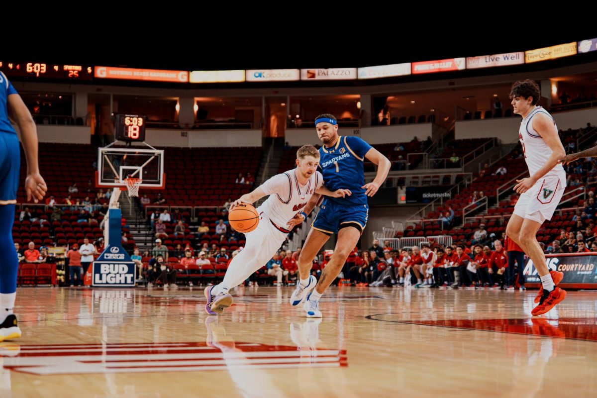 Men's basketball guard Jake Heidbreder drives on a San Jose State Spartan defender on March 3 at the Save Mart Center. Heidbreder ended his last home game as a Bulldog with 20 points in an 82-68 victory over the Spartans