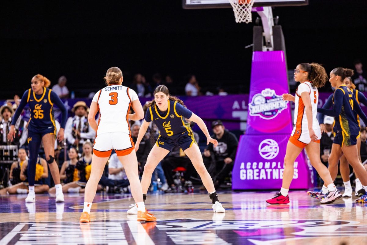 Former California Golden Bears' guard Lola Donez stands at the top of the key to guard against a Syracuse Orange player on March 5 during the second round of the Ally ACC Tournament at Gas South Arena. 