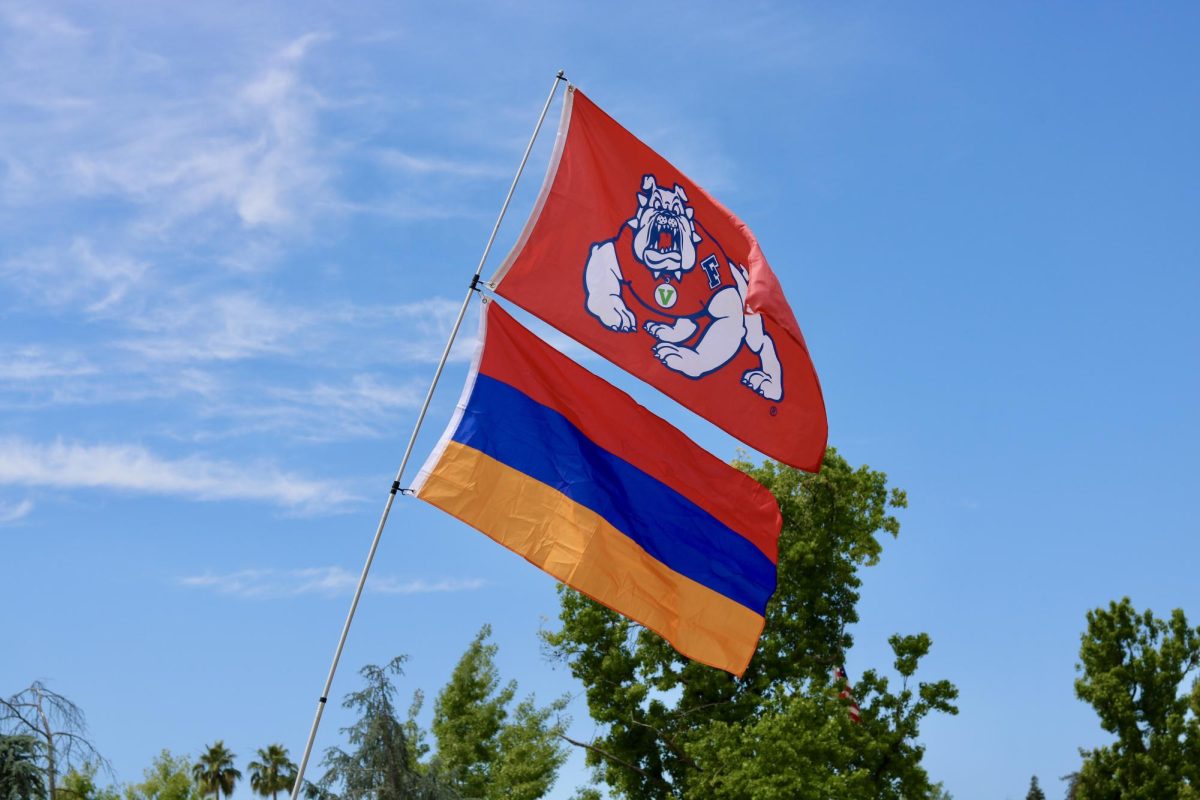 The Fresno State and Armenian flag wave side by side. 