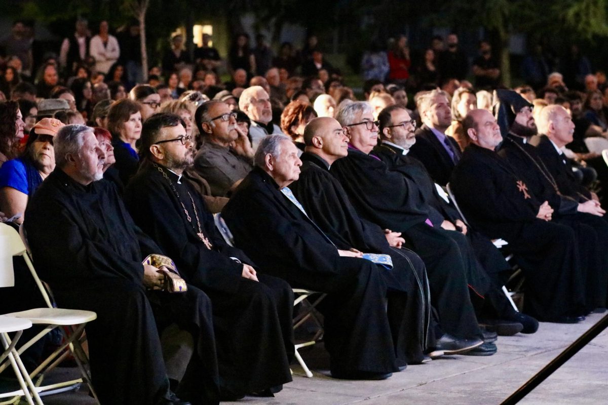 Valley-wide Armenian clergy members sit next to each other as they listen to a video prepared by the event keynote speaker.