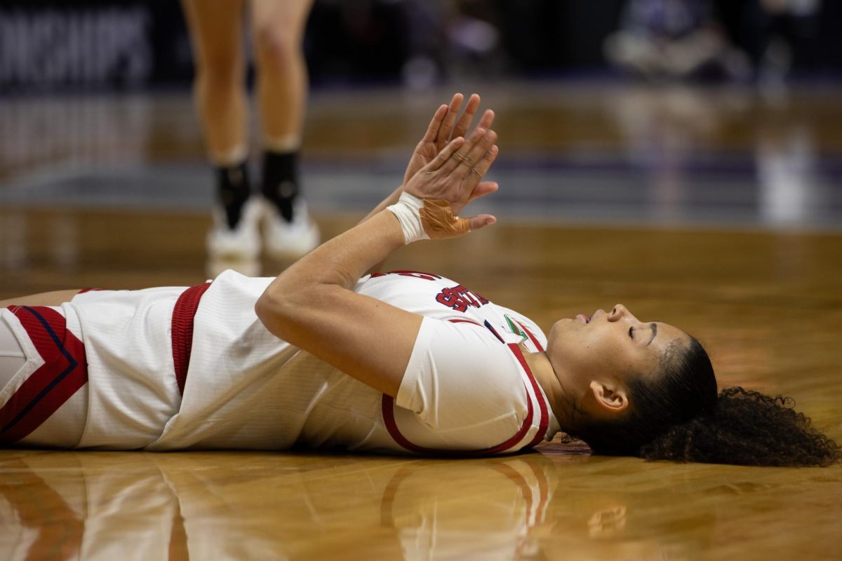 Former Fresno State women's basketball forward Avery Watkins lays on the hardwood with her hands together during the Bulldogs' first round matchup against the Nevada Wolf Pack on March 7 at the Thomas and Mack Center. Watkins announced her transfer to the University of Pittsburgh on April 28 via her Instagram account.