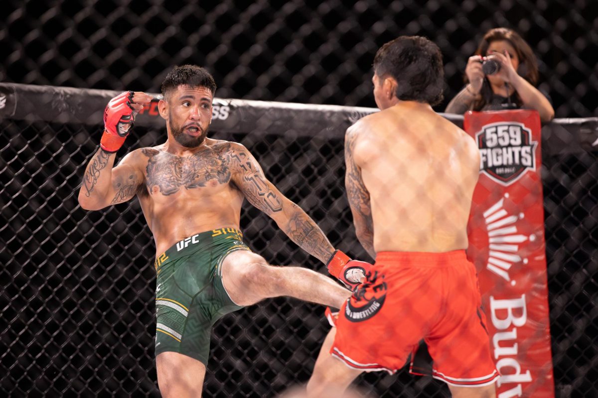 Erique Arroyo (left) throws a kick at German Taboada (right) during the main event of 559 Fights 123.