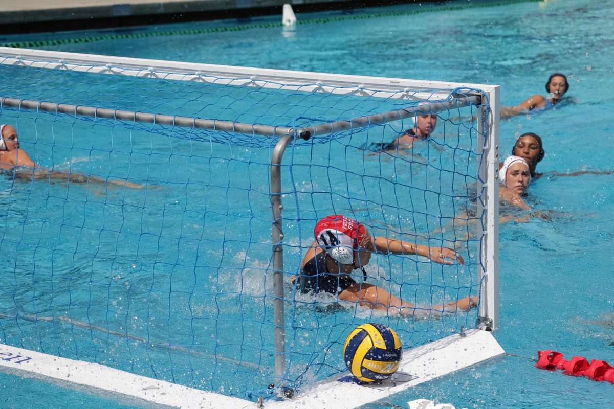 Fresno State water polo goalie Katelyn Mobley attempts to make a save, but the ball goes in the net against the LMU Lions in the Championship Game of the GCC Tournament on April 12.