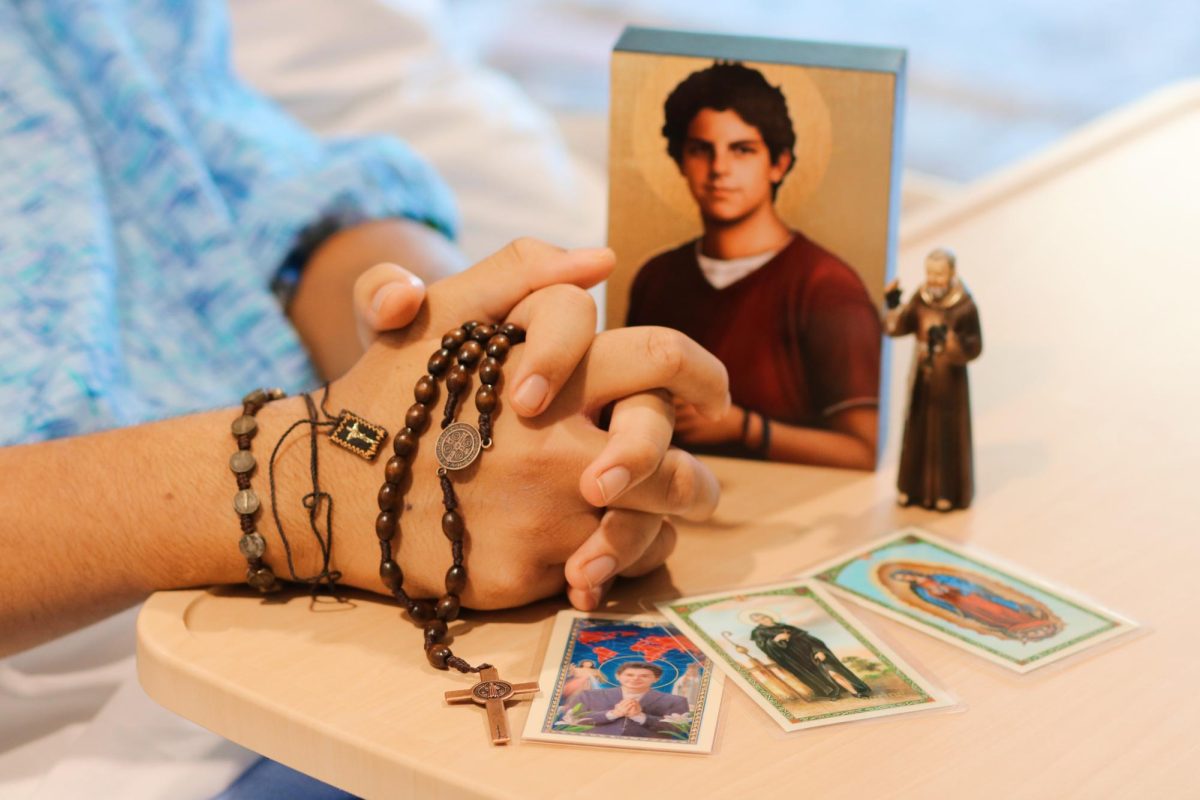 A close-up of some of the Catholic items Joshua keeps in front of his hospital bed. 