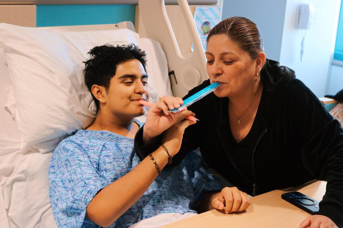 Joshua and his mom share otter pops together. 