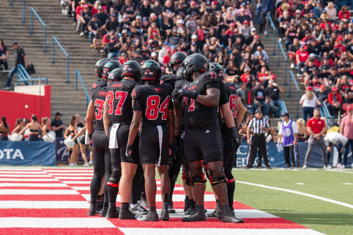 A group of players gather on the turf of Valley Children's Stadium in a game against San Diego State University on Oct. 25 2025.