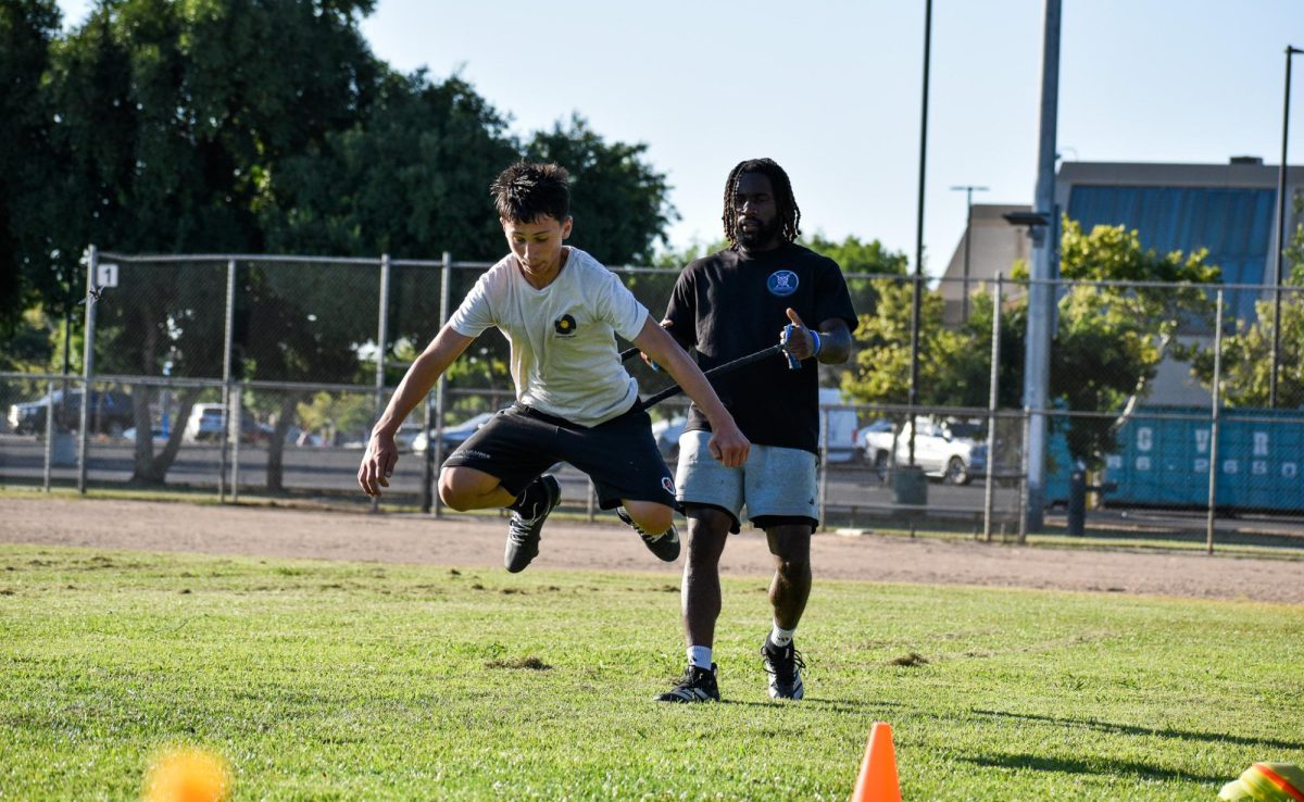 Johnathan Arceneaux training a student at Cary Park on June 25.